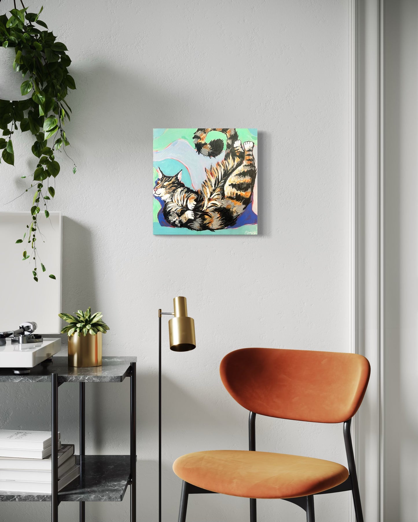 Cozy tabby cat painting in a sitting room. asheville artist