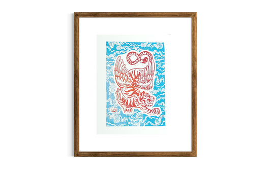 Decorative wall art with a orange and white winged tiger design on a blue and white cloud pattern. by asheville artist erika busse framed