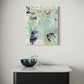 Abstract painting on a wall above a table with a decorative bowl.