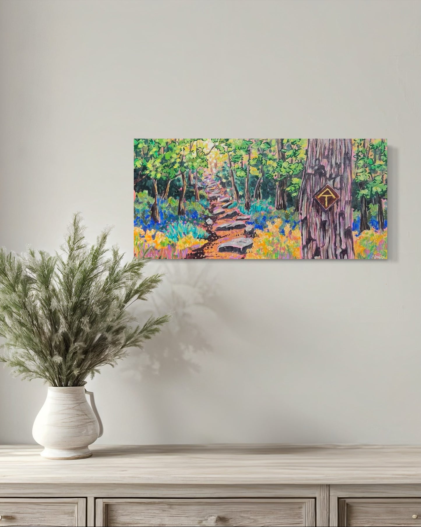 Painting of happy Appalachian trail hike over a table with a plant